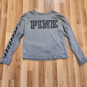 Pink sweatshirt size small runs big.